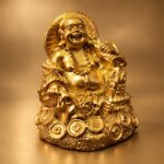 Gold Laughing Buddha Statue with Money Bag and Coins — angled studio view