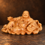 Reclining cypress wood Laughing Buddha with ingot — studio view