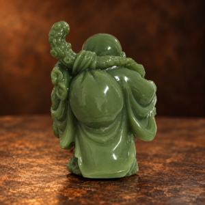 Source-supported rear studio photo of the green resin Laughing Buddha and shoulder bag