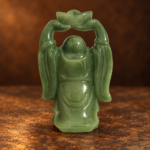 Source-supported rear studio view of the green resin Laughing Buddha with one overhead ingot