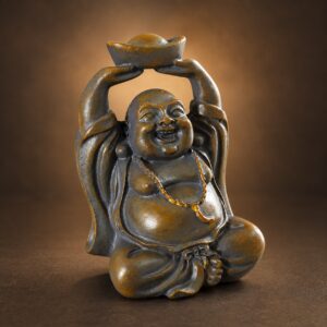 Angled studio view of the miniature stone-colored resin Laughing Buddha on a charcoal-bronze backdrop